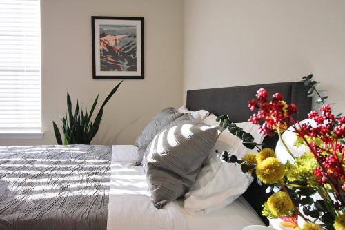 a bedroom with a bed with flowers on it at RiverWinds - Modern Charm Near Shenandoah National Park in Luray