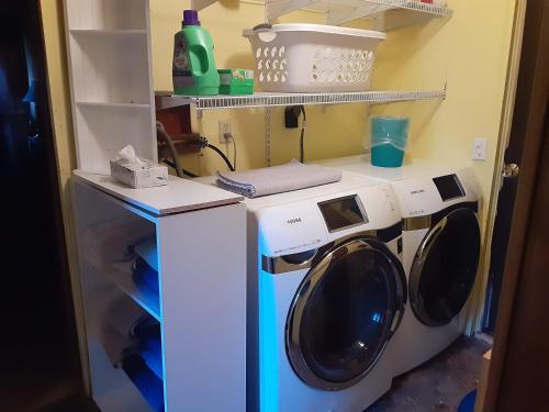 a washer and dryer sitting in a room at Starlight Gardens in Henrieville