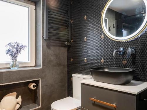a bathroom with a sink and a mirror on the wall at Loft Garmendia con PlayStation in Santander