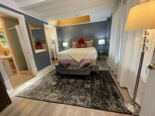 a bedroom with a bed and a large rug at Peace & Plenty Inn Bed and Breakfast Downtown St Augustine-Adults Only in Saint Augustine