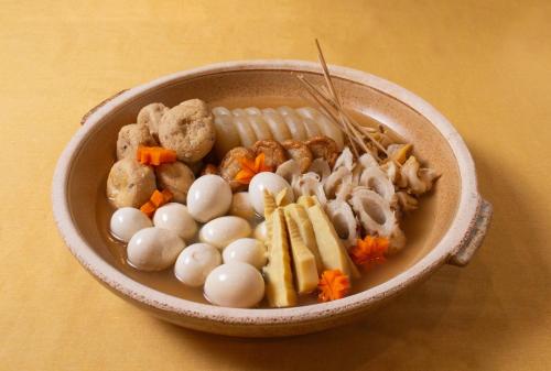 a bowl of food with eggs and meat and vegetables at Hotel Continental Fuchu in Fuchu