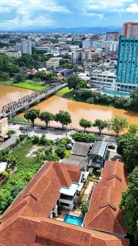 an aerial view of a city with a river at La Seine City Resort, Chiang Mai in Chiang Mai