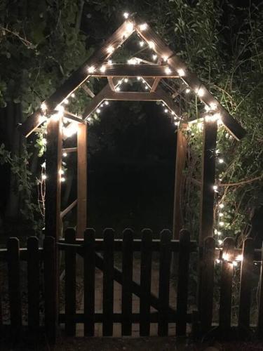 a gazebo with lights on it at night at Starlight Gardens in Henrieville