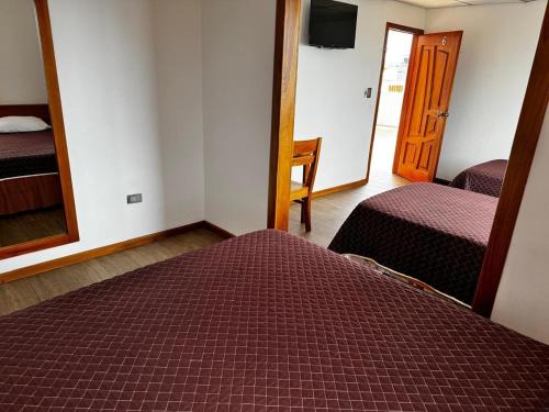Postel nebo postele na pokoji v ubytování Hostal Muyuyo