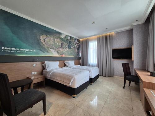 a hotel room with a bed and a large painting on the wall at GIIA Maluku Hotel Thamrin Jakarta in Jakarta