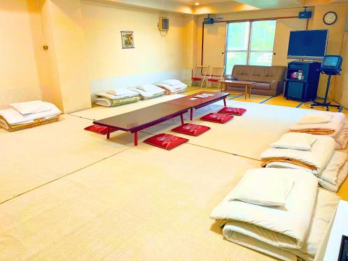 Postel nebo postele na pokoji v ubytování Takasago Onsen