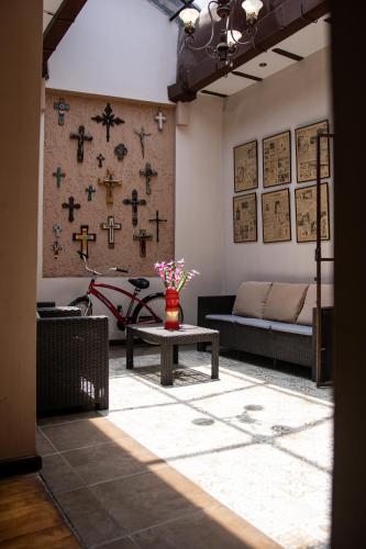 a living room with a couch and a table at Hotel San Benito Cuenca in Cuenca