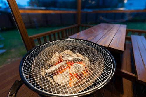 a basket of food sitting on a chair next to a table at Le comte bleu in Pyeongchang 