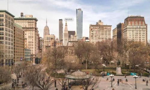 a view of a city with tall buildings at Lovely Room at 3 bedroom Apt at the heart of East Village in New York