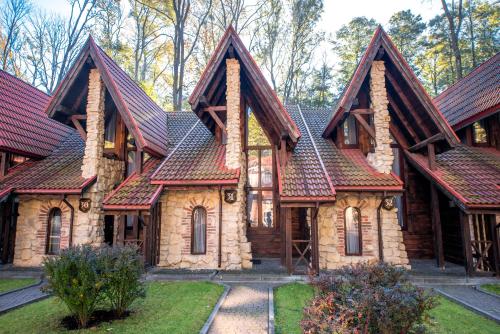 an image of a house with a roof at Drevny Grad Park-hotel in Lviv