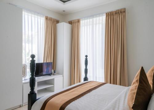 Μια τηλεόραση ή/και κέντρο ψυχαγωγίας στο Bali Residence Villa