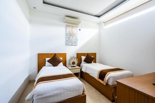Ένα ή περισσότερα κρεβάτια σε δωμάτιο στο Bali Residence Villa
