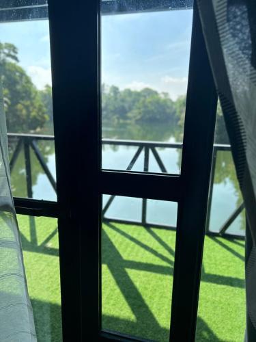 a view of a river from a window at Isla Del Antoño in Cavinti