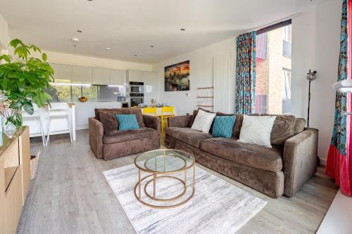 a living room with two couches and a table at FMSS - City Luxe in London