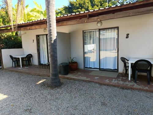 a patio of a house with a table and chairs at Chameleon in Kirkwood