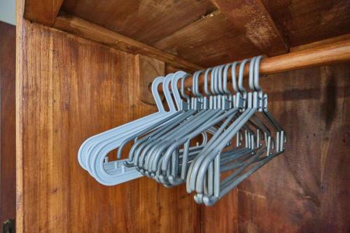 a rack of baseballoons hanging from a wooden ceiling at Unique 1BR Villa for a couple in Ubud in Ubud