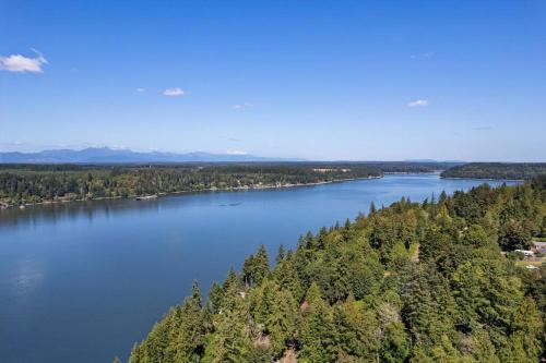 an aerial view of a large river with trees at Captain's Retreat in Shelton