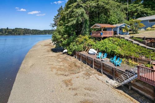a house on the shore of a body of water at Captain's Retreat in Shelton
