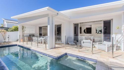 an image of a house with a swimming pool at Elliston House in Kingscliff