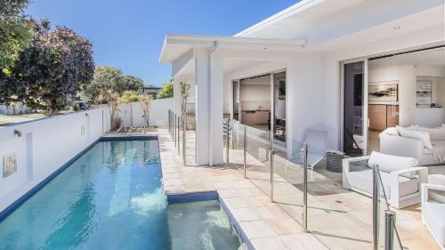 an image of a swimming pool in a house at Elliston House in Kingscliff