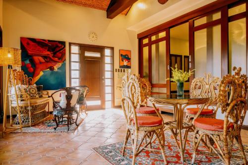 a dining room with a table and chairs at Nawa Wellness in Calatagan