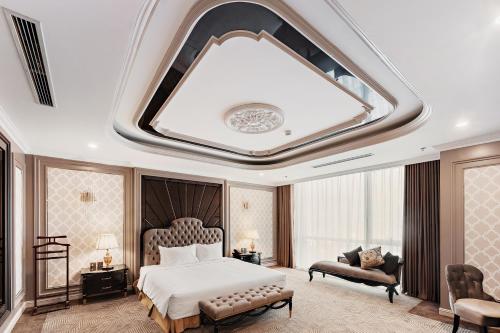 a bedroom with a large bed and a coffered ceiling at Muong Thanh Luxury Cao Bang in Cao Bằng