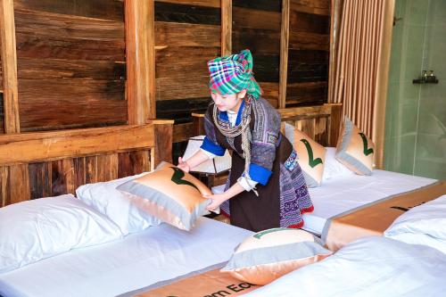 Postel nebo postele na pokoji v ubytování Lam Ecolodge Mu Cang Chai