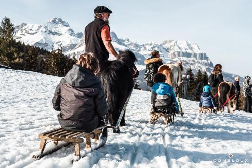 a group of people riding horses in the snow at Chalet Alpen Valley, Mont-Blanc in Combloux