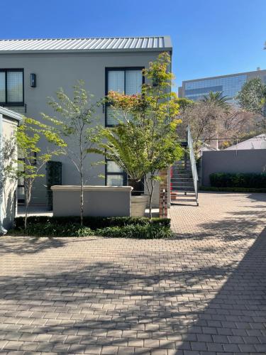 a building with trees in front of it at The Wantage Suites in Johannesburg