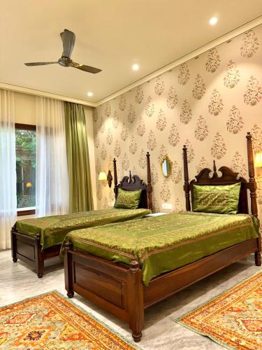 Postel nebo postele na pokoji v ubytování Dera Jaipur Homestay
