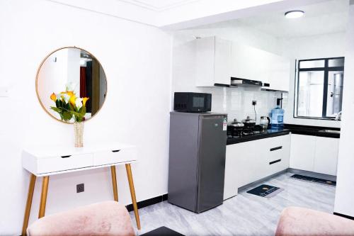 Η κουζίνα ή μικρή κουζίνα στο Haven Suites