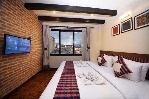 Postel nebo postele na pokoji v ubytování Skye Inn Kathmandu