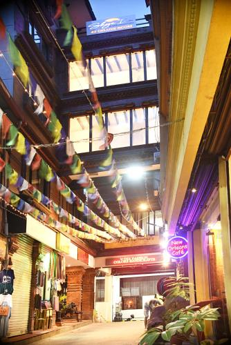 a building with colorful flags hanging from the ceiling at Skye Inn Kathmandu in Kathmandu