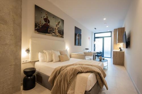 a bedroom with a bed and a living room at FLORIT FLATS - The Benicalap Residences in Valencia