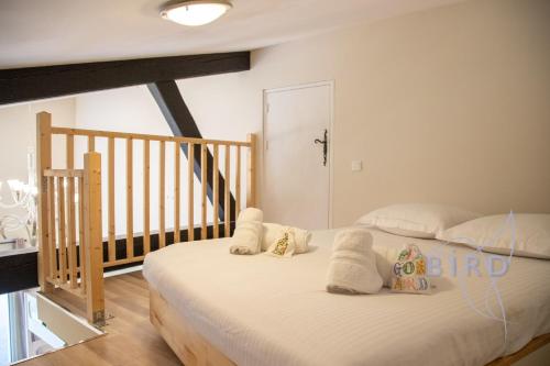 a bedroom with a bed with towels on it at Charming Provencal house in the heart of the Fayence region in Tourrettes