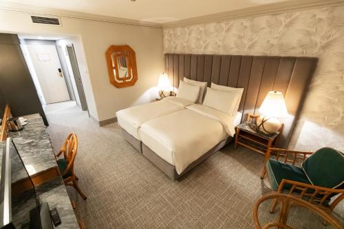 Postel nebo postele na pokoji v ubytování Eventhotel Pyramide