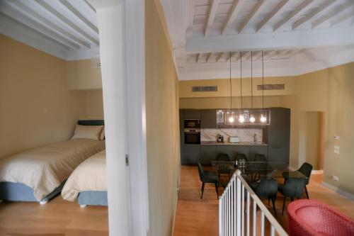 Ένα ή περισσότερα κρεβάτια σε δωμάτιο στο Bargello - Signoria Luxury