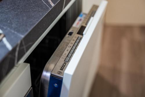 a close up of an appliance with a remote control at Casa delle Note in Modena