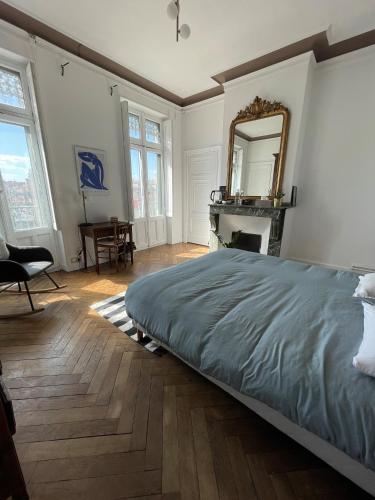 Postel nebo postele na pokoji v ubytování Chambre Comtesse - Climatisée - Proximité métro