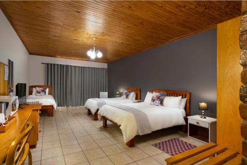Katil atau katil-katil dalam bilik di Merino Inn Hotel