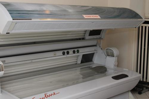 a close up of a microwave oven in a room at Kurhotel Rupertus in Bad Reichenhall