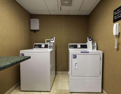 a room with two machines and a phone on the wall at Hampton Inn East Windsor in East Windsor