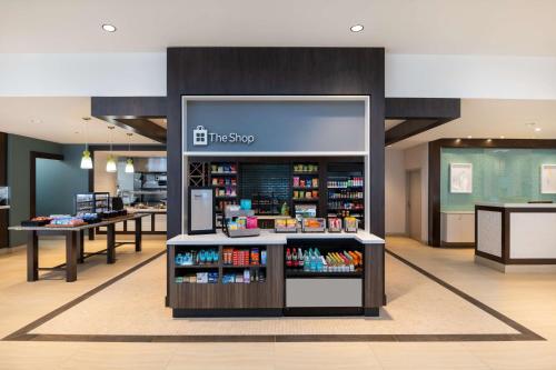 a store with a display case with books at Hilton Garden Inn Daytona Beach Oceanfront in Daytona Beach