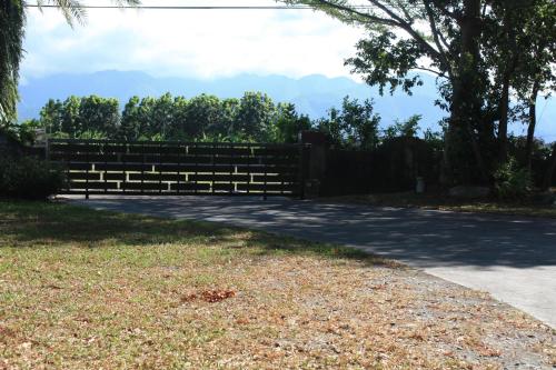 a fence on the side of a road at Phil Garden Homestay in Dongshan