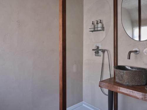 a bathroom with a sink and a mirror at Highway in Burford