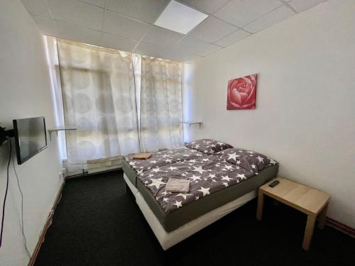 Postel nebo postele na pokoji v ubytování Apartmany Fit Gym