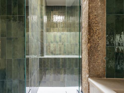 a shower with a glass door in a bathroom at Dare Lisbon River in Lisbon
