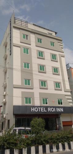 a hotel building with a hotel roin sign on it at Hotel Roi Inn in Tirupati