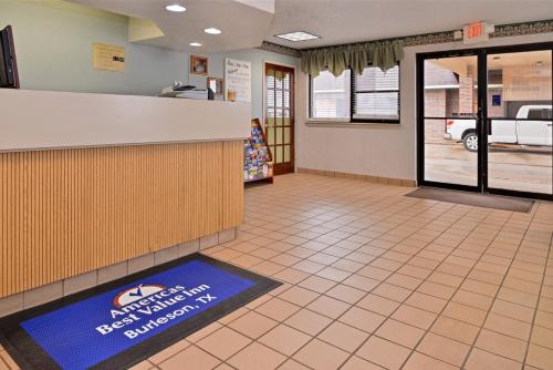 a lobby of a fast food restaurant with a counter at Five Star Inn Burleson in Burleson