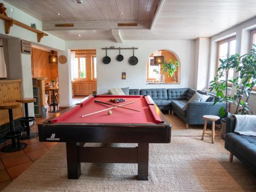 a living room with a pool table in it at Haus Arlberg in Pettneu am Arlberg